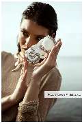 aBitze Fotoartist - Angela M. Schlabitz - Elysian Breeze SS23 Campaign for ANY DI Munich. Santorini is truly a magical place. The pristine white buildings and stunning sunsets make for an incredible sight. Soft hues of light add to the unmatched beauty of