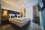 Amrum Residenz GmbH & Co. KG - Schlafzimmer mit Doppelbett