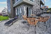 Amrum Residenz GmbH & Co. KG - Terrasse der Amrum Residenz mit Garten Möbeln