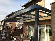 Fiedler Bauelemente GmbH | Fenster | Türen | Wintergarten Siegburg - Terrassenüberdachung mit Markise Fiedler Bauelemente | Siegburg