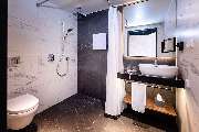 Radisson Blu Hotel at Porsche Design Tower Stuttgart - Accessible Bathroom