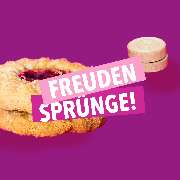 SW Kommunikation - SW Kommunikation Auffälliges Design mit einem Keks und dem Text „FreudenSprünge“ auf pinkem Hintergrund, verspielt und aufmerksamkeitsstark