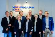 Wehrhahn Immobilien e.K. IVD - Teamfoto Wehrhahn im Büro